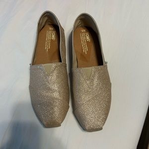 Tom’s taupe sparkle slip ons